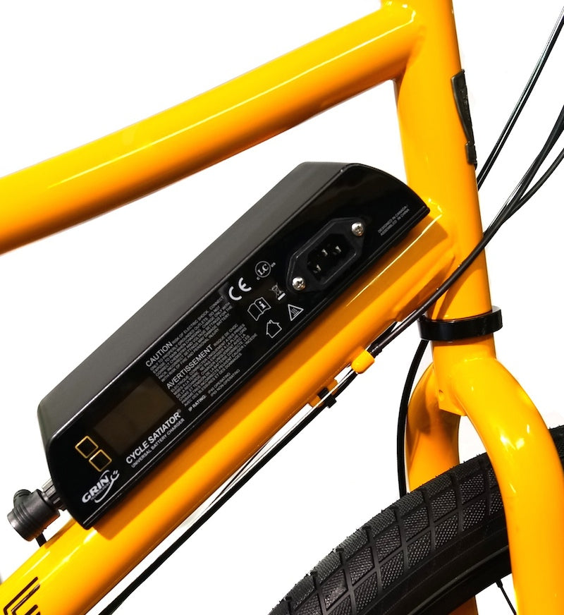 Yellow bicycle frame with a black LiGo battery pack attached on a white background